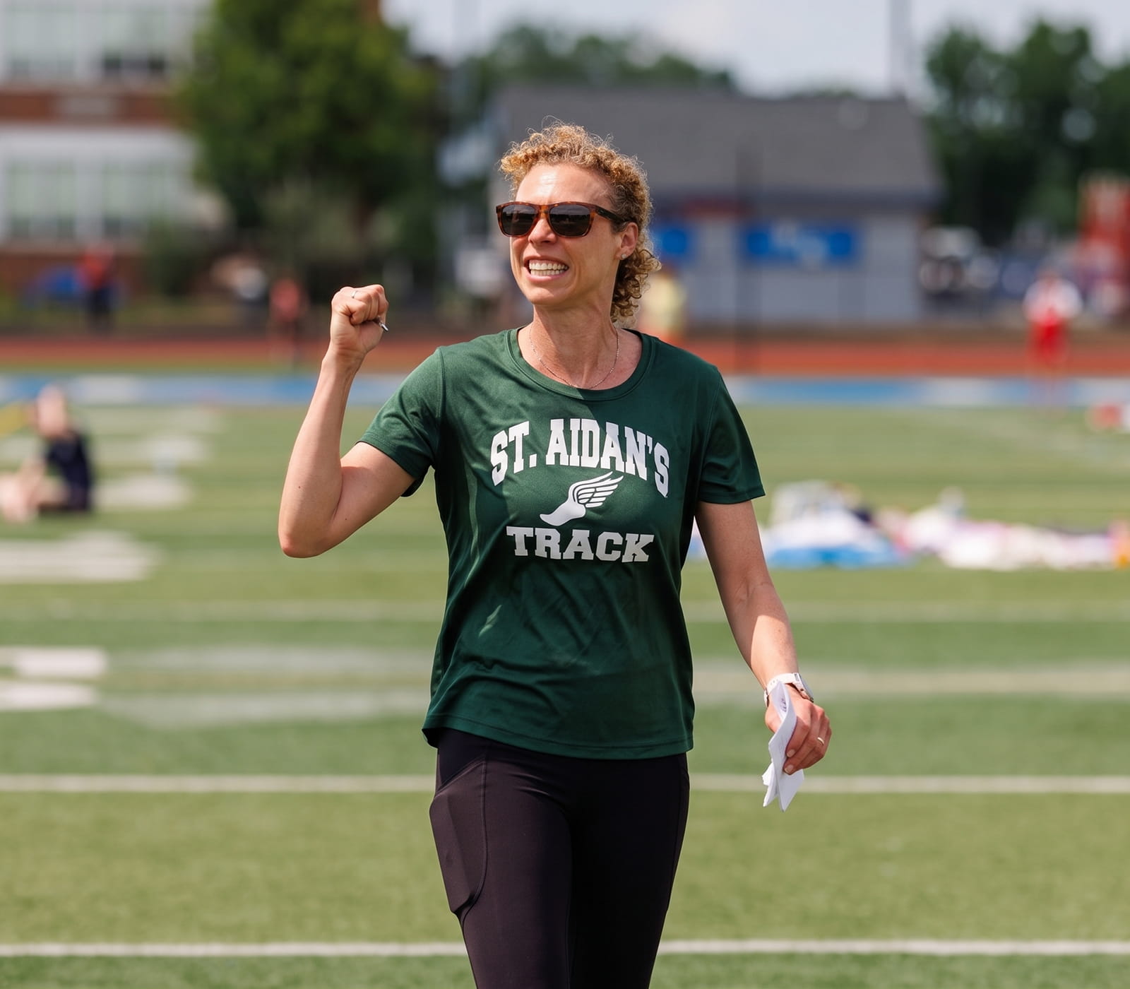 Board-certified orthopedic surgeon Dr. Barbara Steele coaching athletes on the field