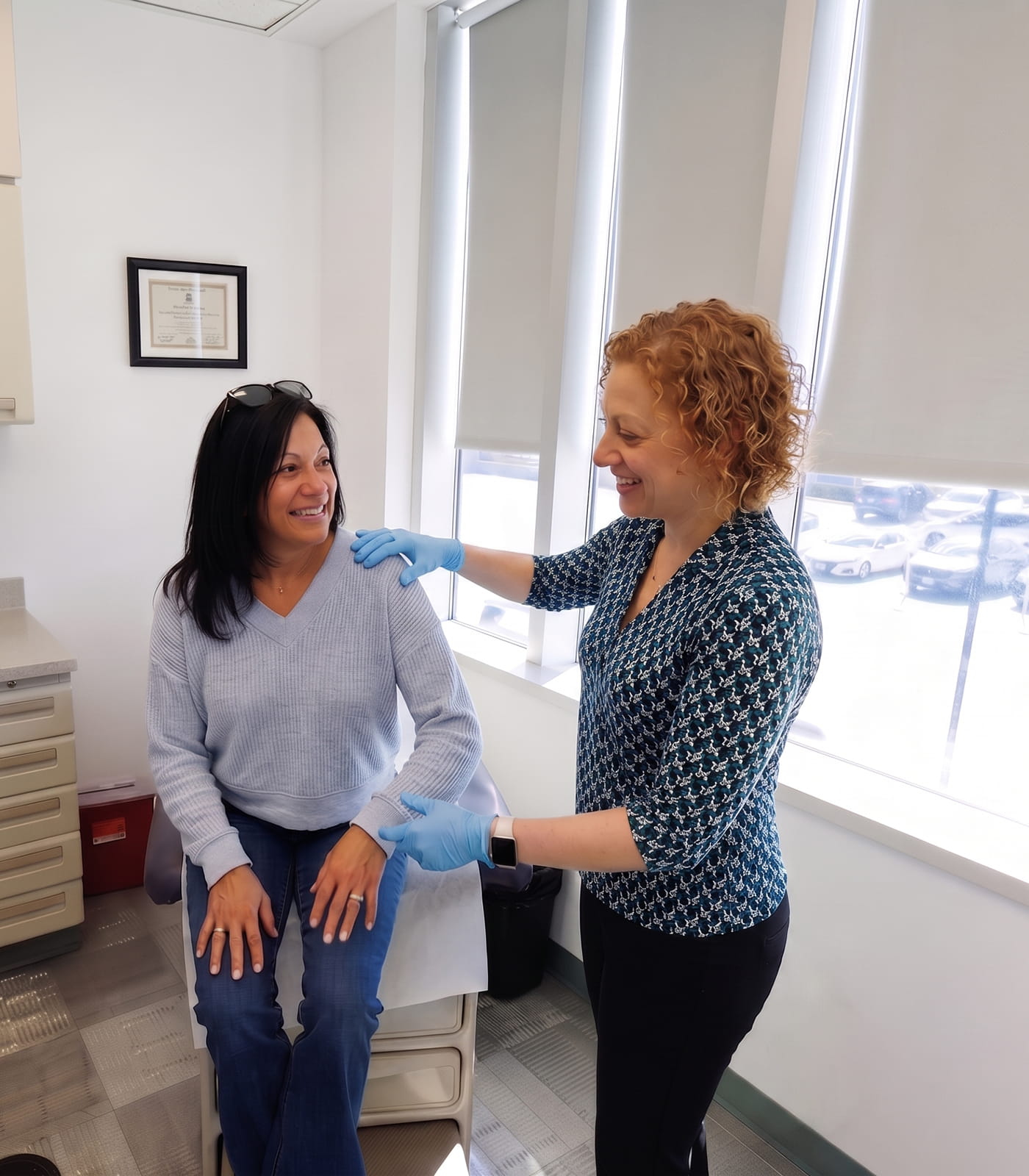 Orthopedic doctor Dr. Steele examining a patient with a rotator cuff shoulder injury