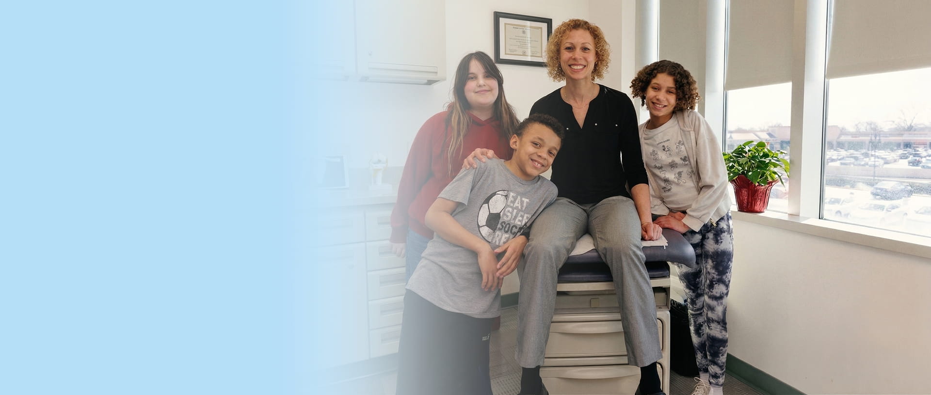 Orthopedic surgeon Dr. Barbara Steele with patients at Steele Orthopedics in Long Island, NY