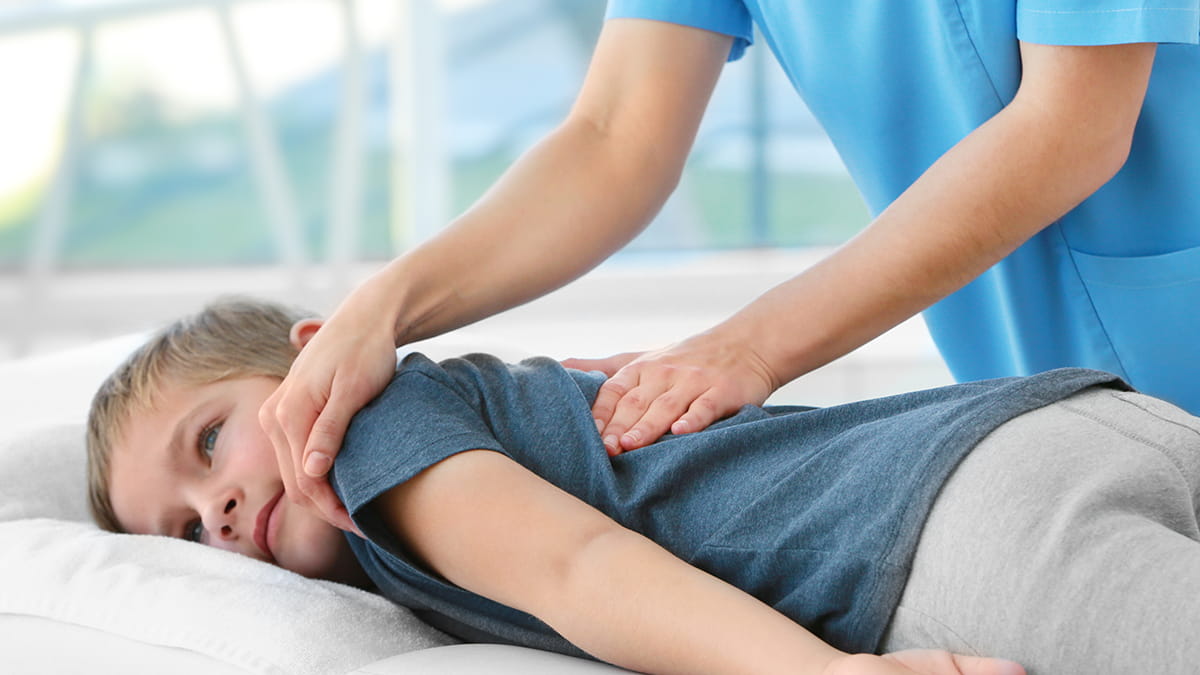 Dr. Steele providing pediatric orthopedic care for a young patient with a sprain