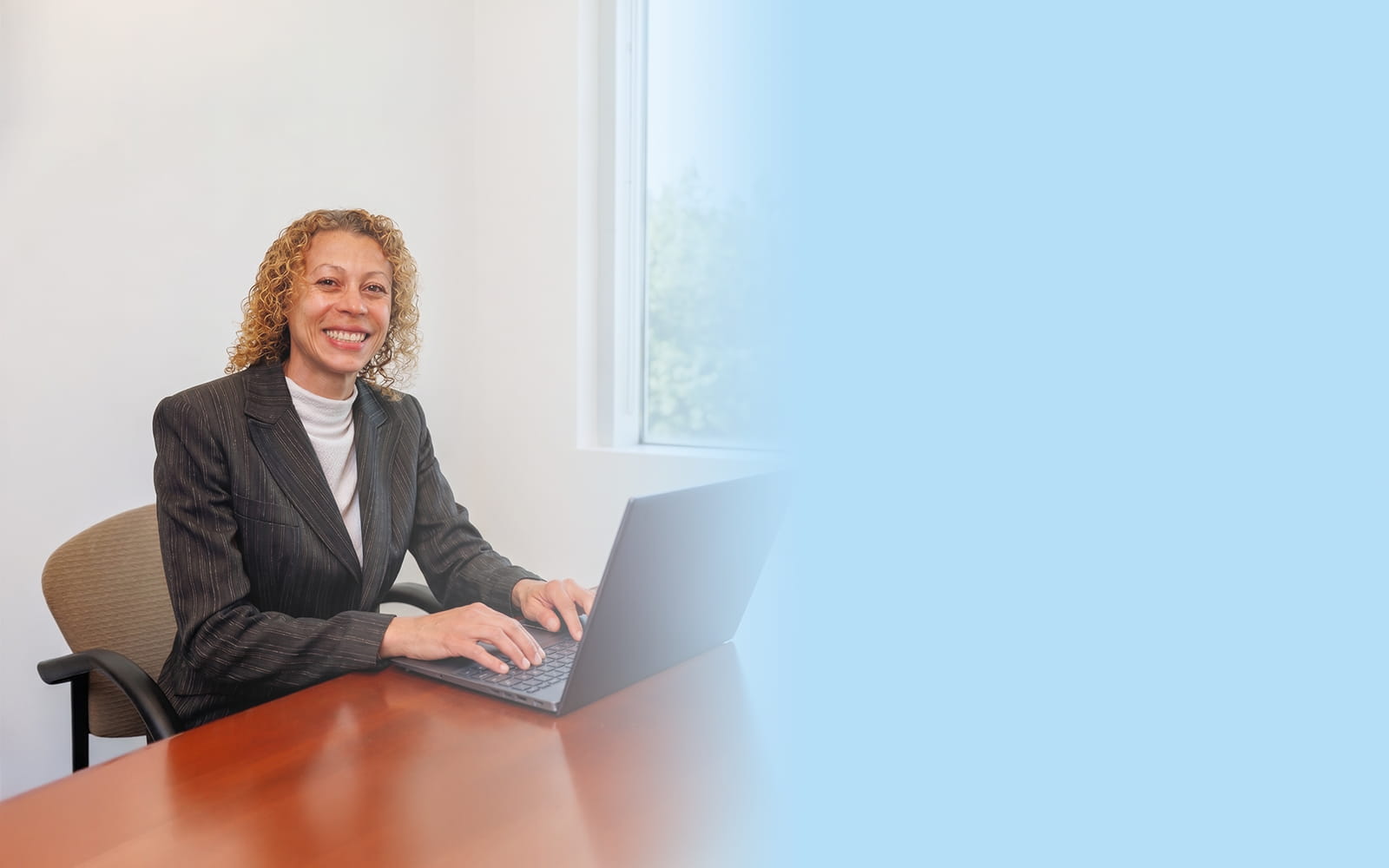 Dr. Barbara Steele in her Long Island office, ready to schedule your orthopedic appointment