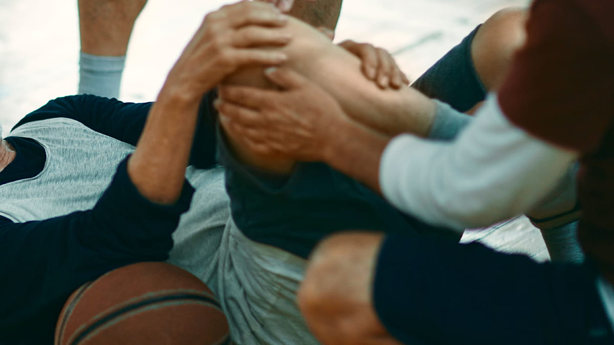 Sports medicine orthopedic surgeon providing treatment for an athlete's injury